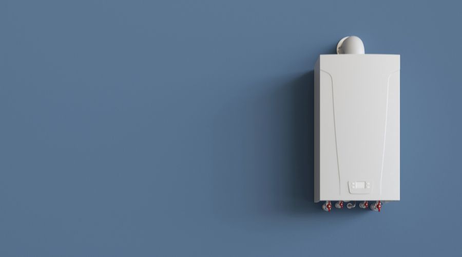 chaudiere a gaz installee sur un mur bleu